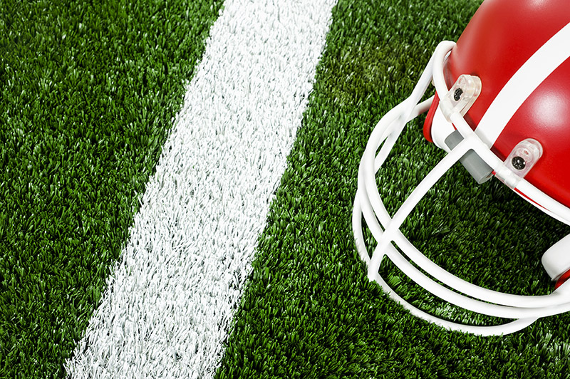 red football helmet on the field